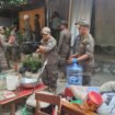 Satpol PP Kota Depok mengevakuasi barang saat penertiban bangunan liar di Jalan Raya Juanda, Depok. (Dicky)