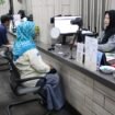 Petugas Imigrasi Depok sedang membantu salah seorang pemohon di Kantor Imigrasi Depok. (Dokumen Imigrasi Depok)